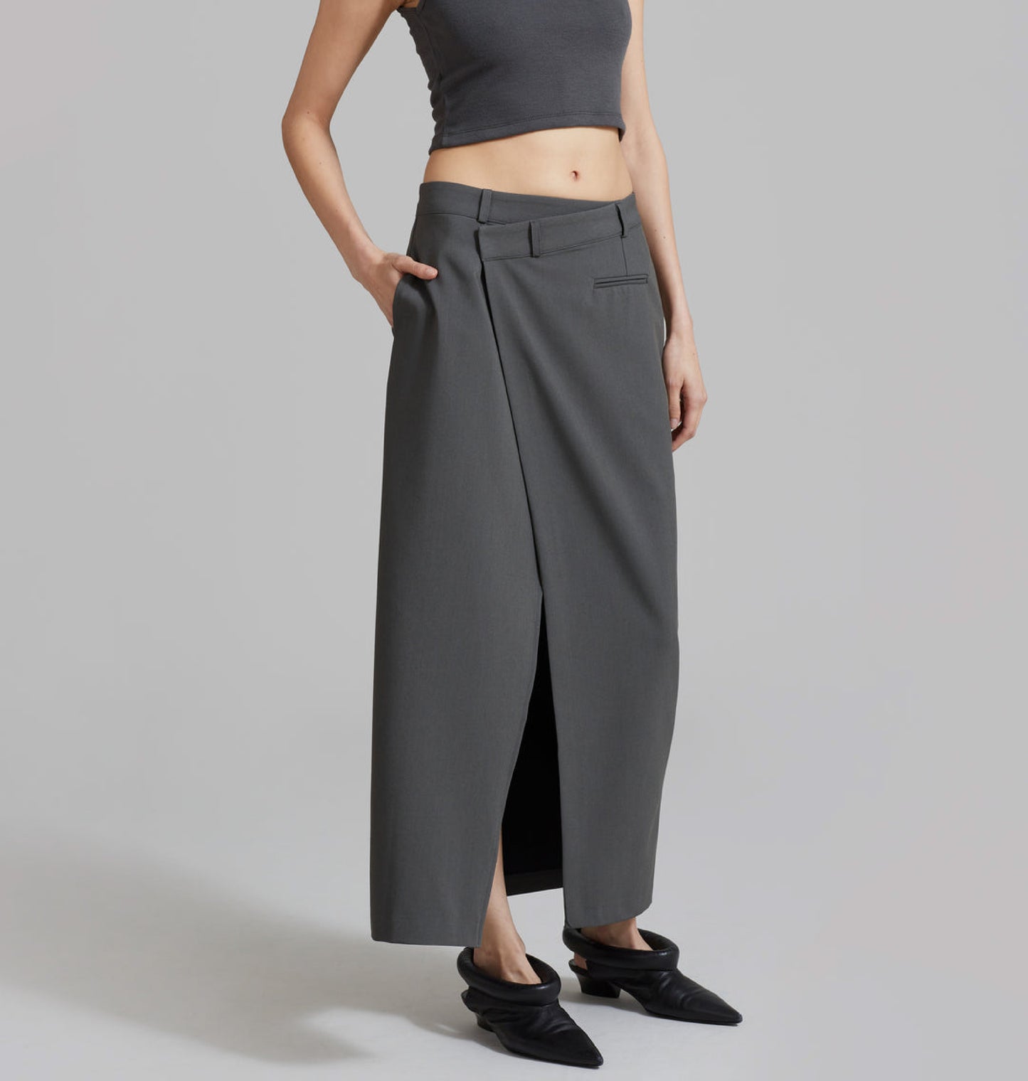 Asymmetrical waist tailored wrap skirt.