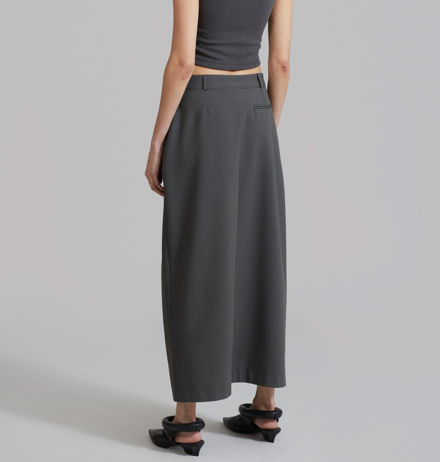 Asymmetrical waist tailored wrap skirt.